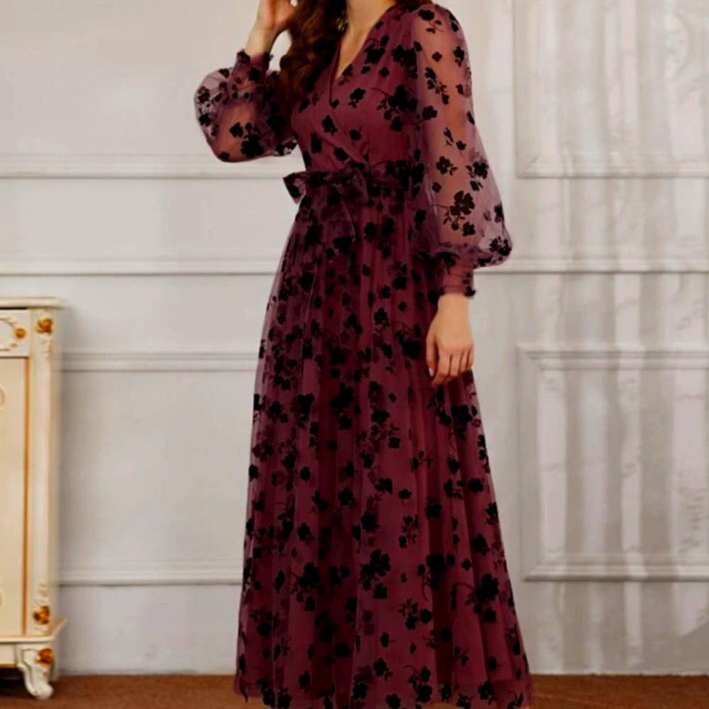 Raspberry dress with black applique flowers, and matching belt.